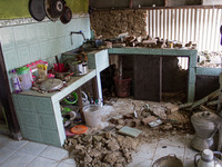 The ruins of a house collapse after a 5.0 magnitude earthquake strikes in Kertasari, West Java, on September 18, 2024. At least 700 houses a...