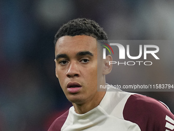 Jamal Musiala of Bayern Munich  looks on  during the Champions League Round 1 match between Bayern Munich v Dinamo Zagreb, at the Allianz Ar...