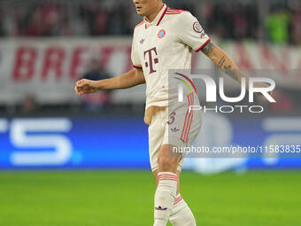 Minjae Kim of Bayern Munich  controls the ball  during the Champions League Round 1 match between Bayern Munich v Dinamo Zagreb, at the Alli...