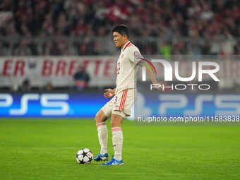 Minjae Kim of Bayern Munich  controls the ball  during the Champions League Round 1 match between Bayern Munich v Dinamo Zagreb, at the Alli...