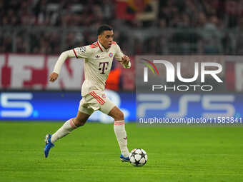 Jamal Musiala of Bayern Munich  controls the ball  during the Champions League Round 1 match between Bayern Munich v Dinamo Zagreb, at the A...