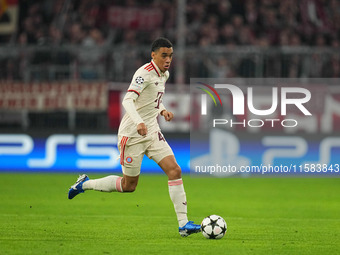 Jamal Musiala of Bayern Munich  controls the ball  during the Champions League Round 1 match between Bayern Munich v Dinamo Zagreb, at the A...