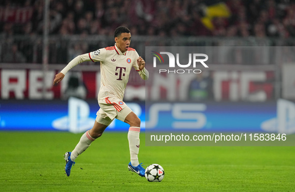 Jamal Musiala of Bayern Munich  controls the ball  during the Champions League Round 1 match between Bayern Munich v Dinamo Zagreb, at the A...