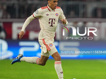 Jamal Musiala of Bayern Munich  controls the ball  during the Champions League Round 1 match between Bayern Munich v Dinamo Zagreb, at the A...