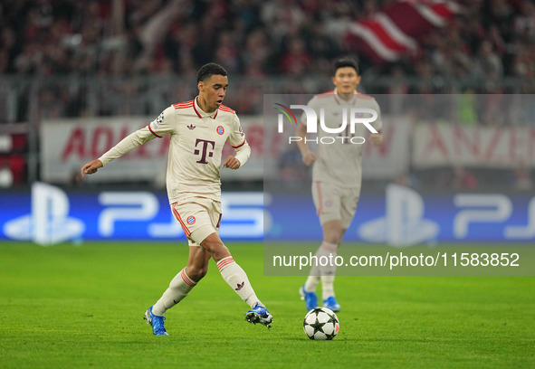 Jamal Musiala of Bayern Munich  controls the ball  during the Champions League Round 1 match between Bayern Munich v Dinamo Zagreb, at the A...