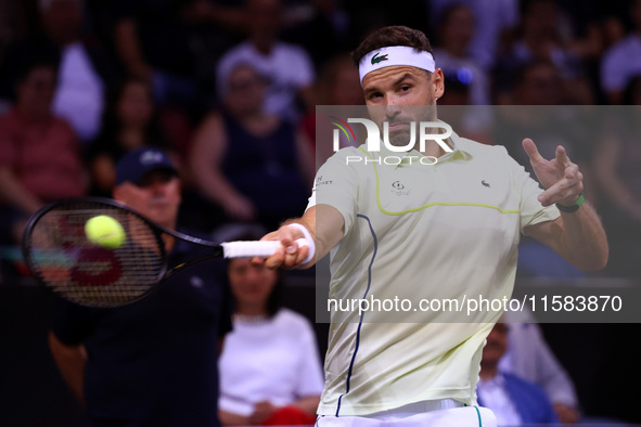 Bulgaria's Grigor Dimitrov plays during his tennis gala match against Serbia's Novak Djokovic at Arena Sofia hall in Sofia, Bulgaria, on Sep...