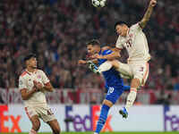 Minjae Kim of Bayern Munich and Marko Pjaca of GNK Dinamo battle for the ball  during the Champions League Round 1 match between Bayern Muni...