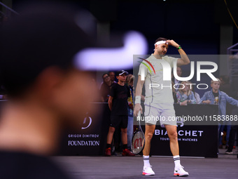 Bulgaria's Grigor Dimitrov plays during his tennis gala match against Serbia's Novak Djokovic at Arena Sofia hall in Sofia, Bulgaria, on Sep...