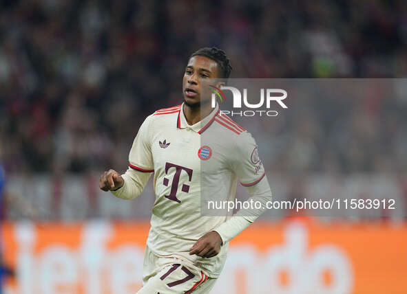 Michael Olise of Bayern Munich  looks on  during the Champions League Round 1 match between Bayern Munich v Dinamo Zagreb, at the Allianz Ar...