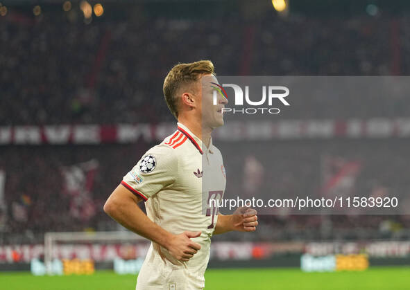 Joshua Kimmich of Bayern Munich  looks on  during the Champions League Round 1 match between Bayern Munich v Dinamo Zagreb, at the Allianz A...