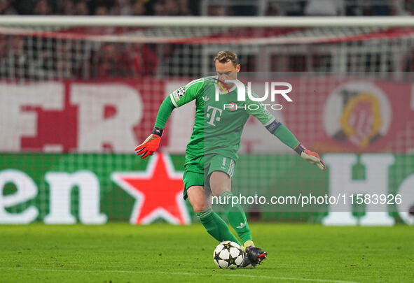 Manuel Neuer of Bayern Munich  controls the ball  during the Champions League Round 1 match between Bayern Munich v Dinamo Zagreb, at the Al...