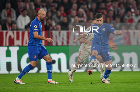 Martin Baturina of GNK Dinamo  controls the ball  during the Champions League Round 1 match between Bayern Munich v Dinamo Zagreb, at the Al...