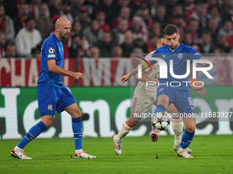 Martin Baturina of GNK Dinamo  controls the ball  during the Champions League Round 1 match between Bayern Munich v Dinamo Zagreb, at the Al...