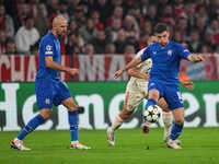 Martin Baturina of GNK Dinamo  controls the ball  during the Champions League Round 1 match between Bayern Munich v Dinamo Zagreb, at the Al...