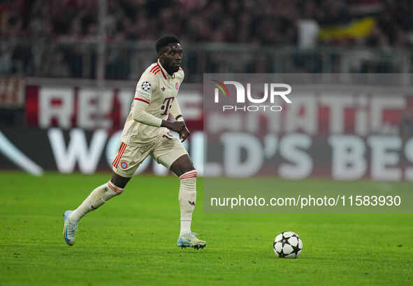 Alphonso Davies of Bayern Munich  controls the ball  during the Champions League Round 1 match between Bayern Munich v Dinamo Zagreb, at the...