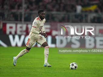 Alphonso Davies of Bayern Munich  controls the ball  during the Champions League Round 1 match between Bayern Munich v Dinamo Zagreb, at the...