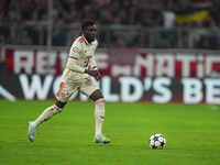 Alphonso Davies of Bayern Munich  controls the ball  during the Champions League Round 1 match between Bayern Munich v Dinamo Zagreb, at the...