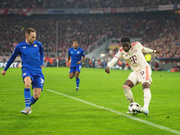 Alphonso Davies of Bayern Munich  controls the ball  during the Champions League Round 1 match between Bayern Munich v Dinamo Zagreb, at the...