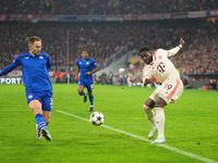 Alphonso Davies of Bayern Munich  controls the ball  during the Champions League Round 1 match between Bayern Munich v Dinamo Zagreb, at the...