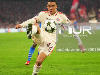 Jamal Musiala of Bayern Munich  controls the ball  during the Champions League Round 1 match between Bayern Munich v Dinamo Zagreb, at the A...