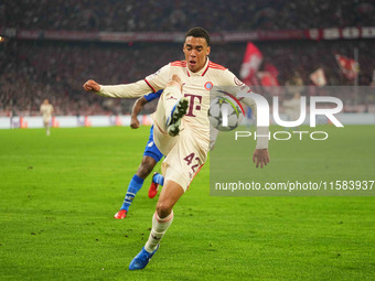 Jamal Musiala of Bayern Munich  controls the ball  during the Champions League Round 1 match between Bayern Munich v Dinamo Zagreb, at the A...