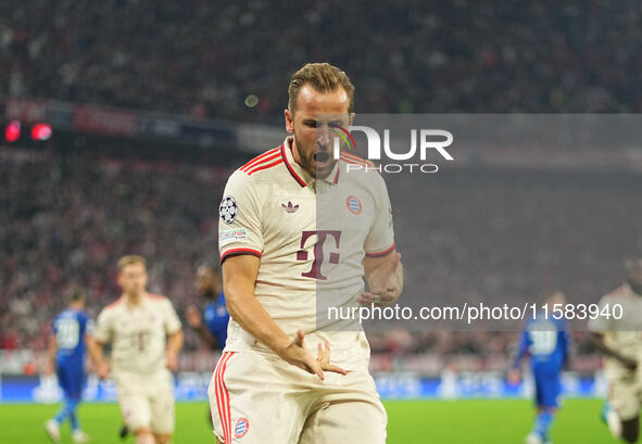 Harry Kane of Bayern Munich  celebrates  the teams first goal  during the Champions League Round 1 match between Bayern Munich v Dinamo Zagr...