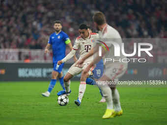 Jamal Musiala of Bayern Munich  controls the ball  during the Champions League Round 1 match between Bayern Munich v Dinamo Zagreb, at the A...