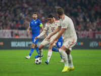 Jamal Musiala of Bayern Munich  controls the ball  during the Champions League Round 1 match between Bayern Munich v Dinamo Zagreb, at the A...