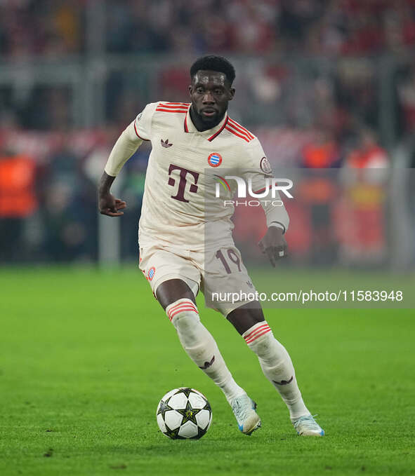 Alphonso Davies of Bayern Munich  controls the ball  during the Champions League Round 1 match between Bayern Munich v Dinamo Zagreb, at the...