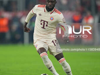 Alphonso Davies of Bayern Munich  controls the ball  during the Champions League Round 1 match between Bayern Munich v Dinamo Zagreb, at the...