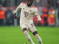 Alphonso Davies of Bayern Munich  controls the ball  during the Champions League Round 1 match between Bayern Munich v Dinamo Zagreb, at the...