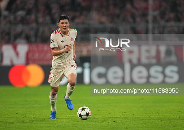 Minjae Kim of Bayern Munich  controls the ball  during the Champions League Round 1 match between Bayern Munich v Dinamo Zagreb, at the Alli...