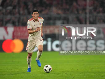 Minjae Kim of Bayern Munich  controls the ball  during the Champions League Round 1 match between Bayern Munich v Dinamo Zagreb, at the Alli...