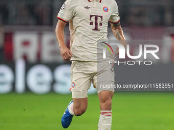 Minjae Kim of Bayern Munich  controls the ball  during the Champions League Round 1 match between Bayern Munich v Dinamo Zagreb, at the Alli...