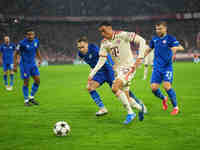 Jamal Musiala of Bayern Munich  controls the ball  during the Champions League Round 1 match between Bayern Munich v Dinamo Zagreb, at the A...