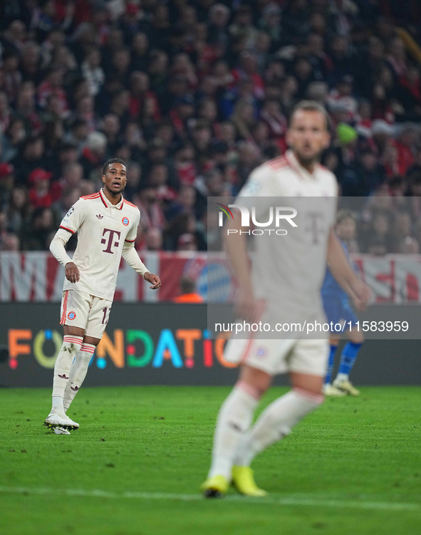 Michael Olise of Bayern Munich  looks on  during the Champions League Round 1 match between Bayern Munich v Dinamo Zagreb, at the Allianz Ar...