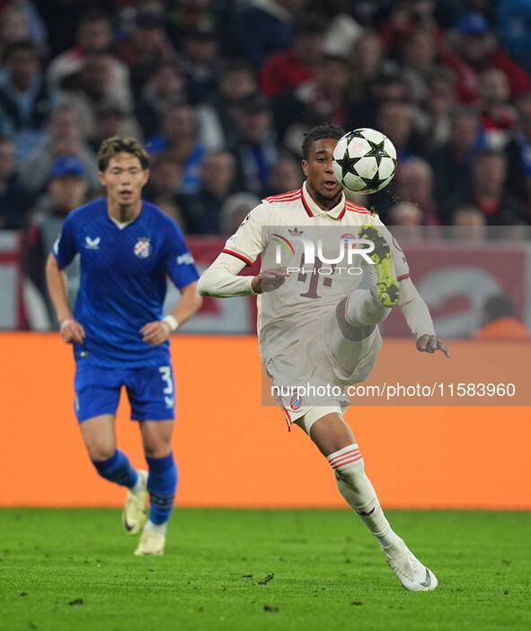 Michael Olise of Bayern Munich  controls the ball  during the Champions League Round 1 match between Bayern Munich v Dinamo Zagreb, at the A...