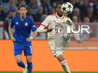 Michael Olise of Bayern Munich  controls the ball  during the Champions League Round 1 match between Bayern Munich v Dinamo Zagreb, at the A...