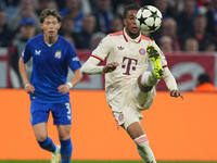 Michael Olise of Bayern Munich  controls the ball  during the Champions League Round 1 match between Bayern Munich v Dinamo Zagreb, at the A...