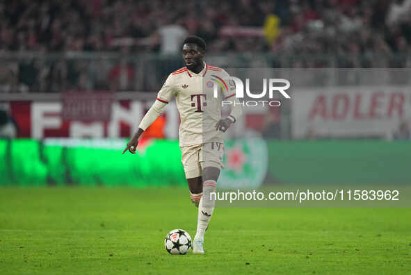 Alphonso Davies of Bayern Munich  controls the ball  during the Champions League Round 1 match between Bayern Munich v Dinamo Zagreb, at the...