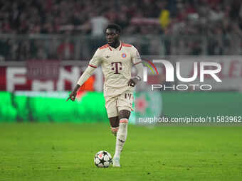 Alphonso Davies of Bayern Munich  controls the ball  during the Champions League Round 1 match between Bayern Munich v Dinamo Zagreb, at the...