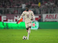 Alphonso Davies of Bayern Munich  controls the ball  during the Champions League Round 1 match between Bayern Munich v Dinamo Zagreb, at the...