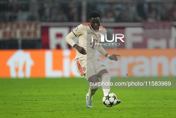 Alphonso Davies of Bayern Munich  controls the ball  during the Champions League Round 1 match between Bayern Munich v Dinamo Zagreb, at the...