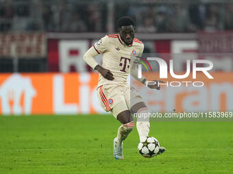 Alphonso Davies of Bayern Munich  controls the ball  during the Champions League Round 1 match between Bayern Munich v Dinamo Zagreb, at the...