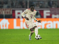 Alphonso Davies of Bayern Munich  controls the ball  during the Champions League Round 1 match between Bayern Munich v Dinamo Zagreb, at the...