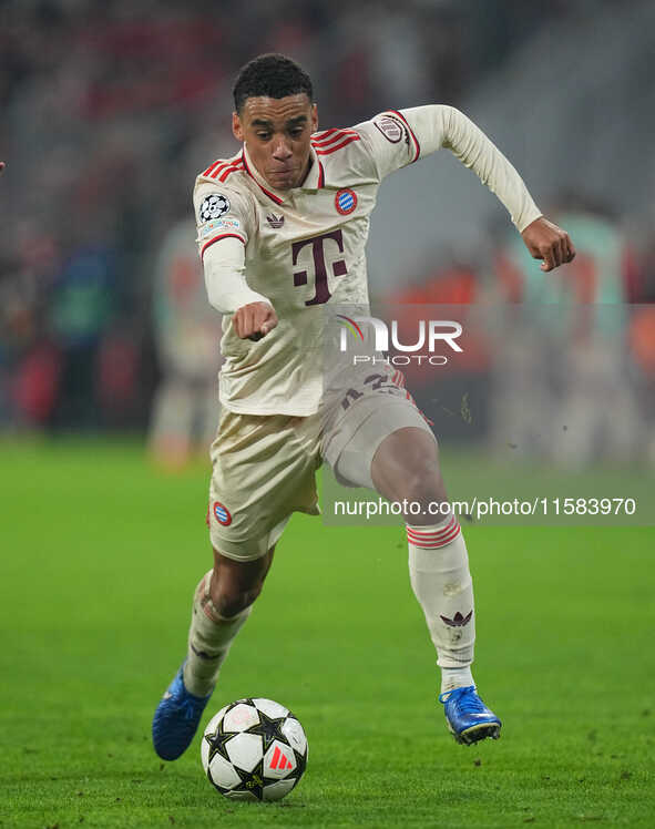 Jamal Musiala of Bayern Munich  controls the ball  during the Champions League Round 1 match between Bayern Munich v Dinamo Zagreb, at the A...