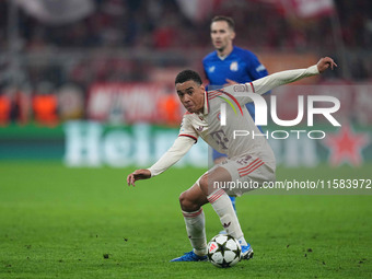 Jamal Musiala of Bayern Munich  controls the ball  during the Champions League Round 1 match between Bayern Munich v Dinamo Zagreb, at the A...