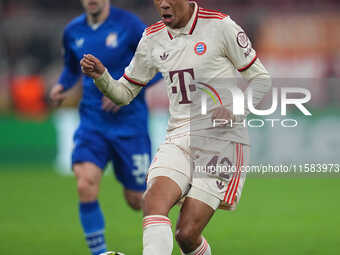 Jamal Musiala of Bayern Munich  controls the ball  during the Champions League Round 1 match between Bayern Munich v Dinamo Zagreb, at the A...