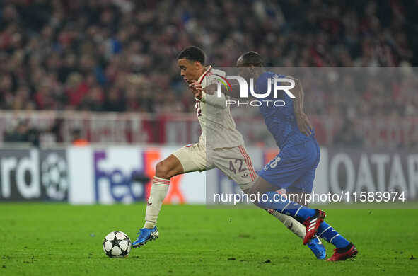 Jamal Musiala of Bayern Munich  controls the ball  during the Champions League Round 1 match between Bayern Munich v Dinamo Zagreb, at the A...