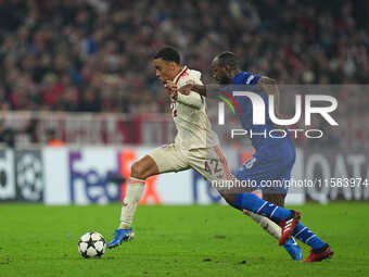 Jamal Musiala of Bayern Munich  controls the ball  during the Champions League Round 1 match between Bayern Munich v Dinamo Zagreb, at the A...